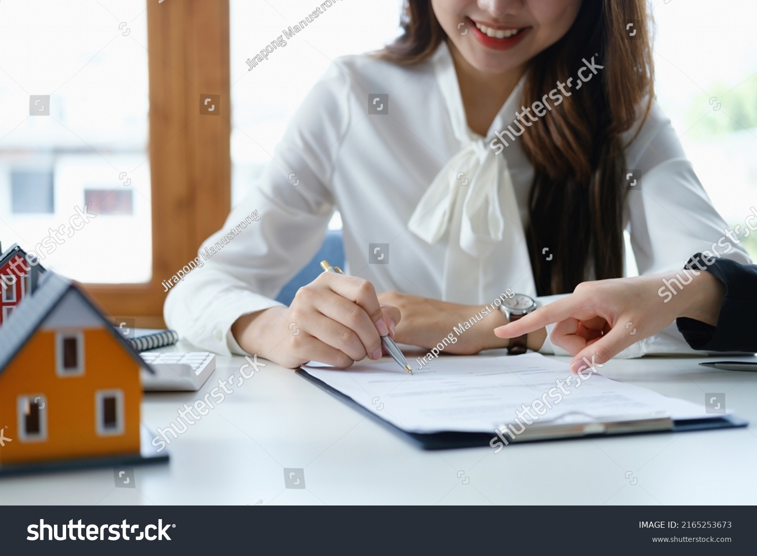 Stock photo guarantee mortgage agreement contract sign the customer is signing the contract document as 2165253673