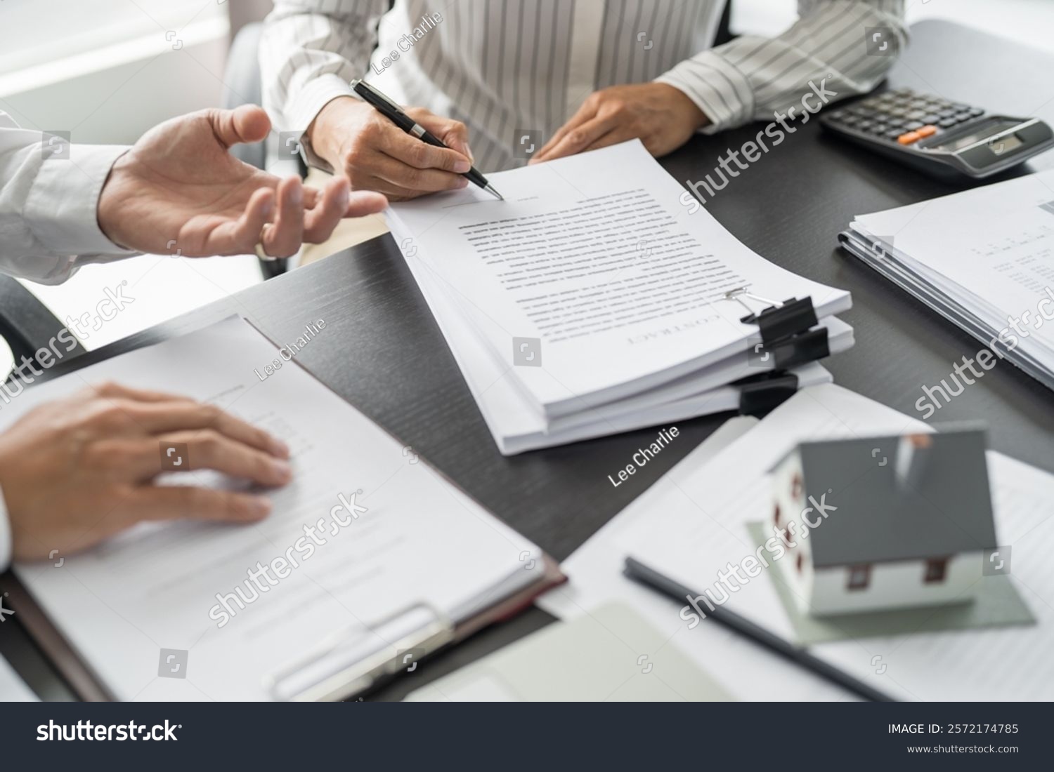 Stock photo sales manager giving advice application form document considering mortgage loan offer for car and 2572174785 1